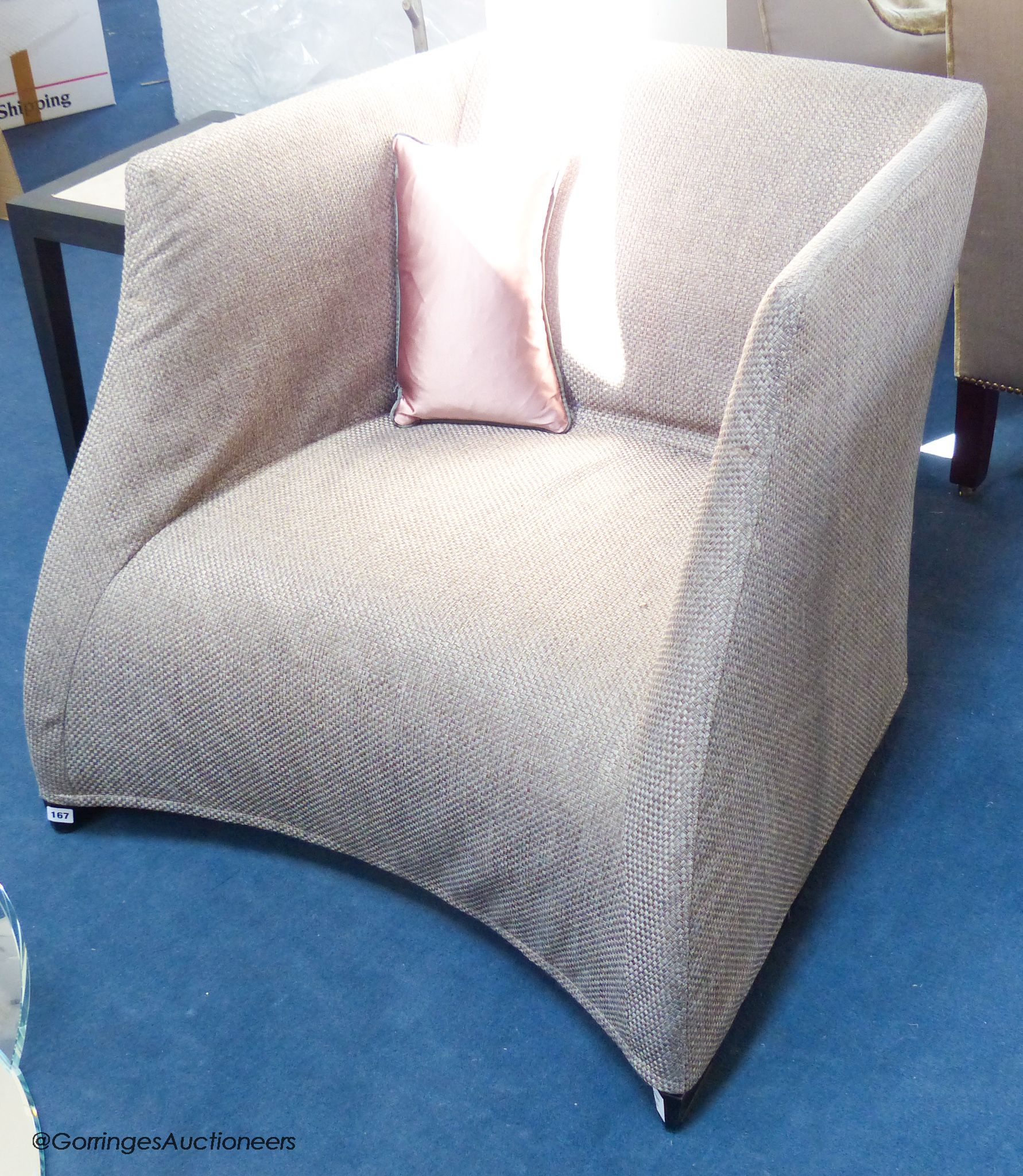 A contemporary upholstered armchair